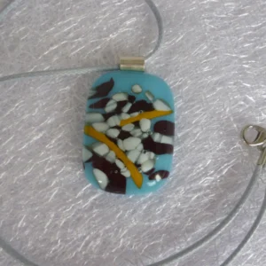 Unusual blue and white pendant with brown and tan colours on top. 925 sterling silver bail with grey cord necklace.