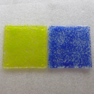 One green and one blue mottle effect glass coasters