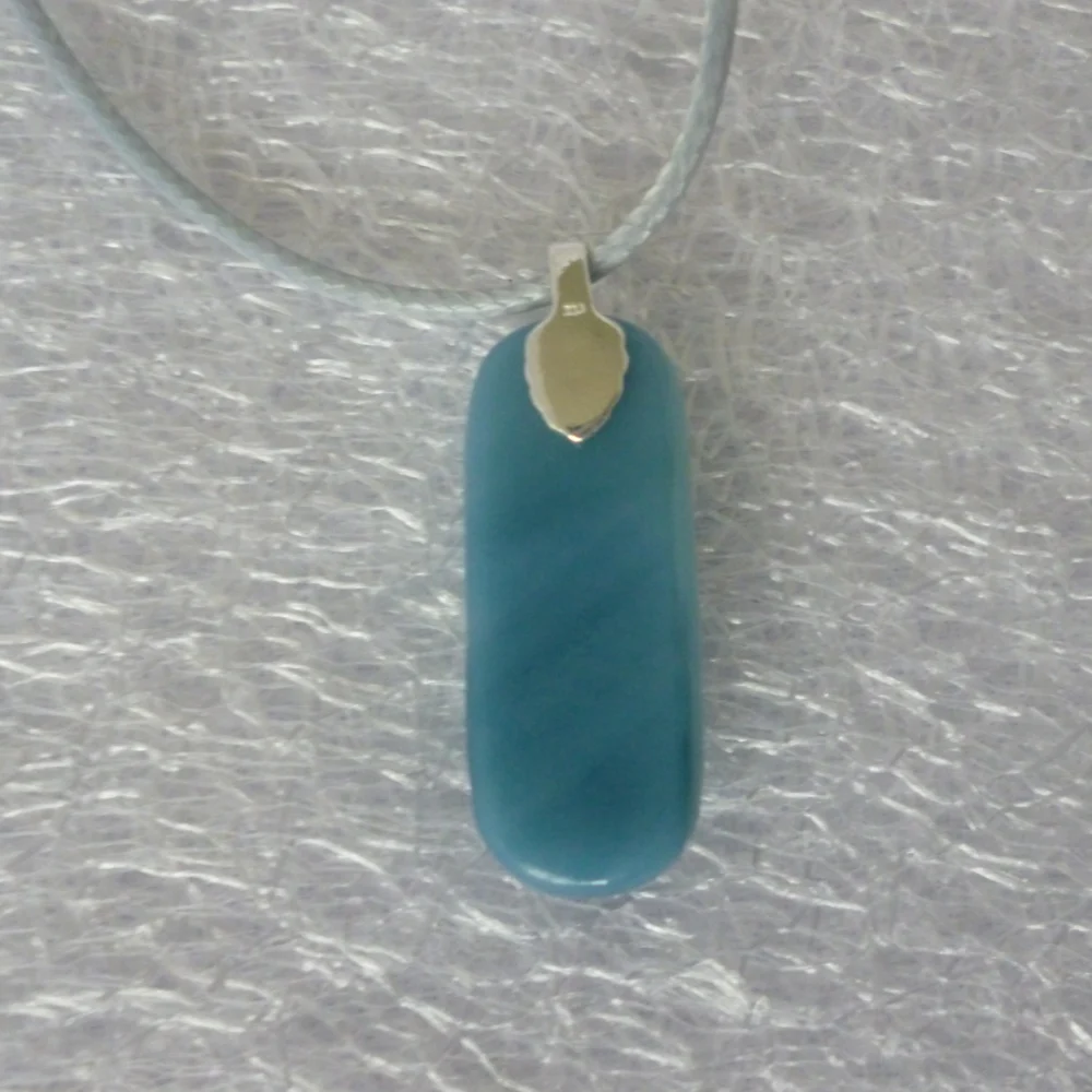 Back of blue dichroic glass pendant with 925 sterling silver bail and grey cord necklace.