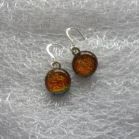 Orange dichroic glass cabochons attached to silver plated bail and 925 sterling silver earwires.