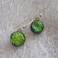 round green dichroic cabochons attached to sterling silver earwires.
