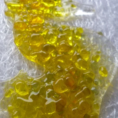 Close up of the tactile yellow frit on the seahorse, lots of lumps and bumps.