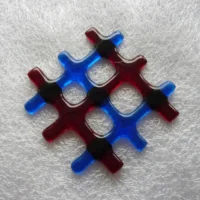 Suncatcher laying flat on a white cloth.