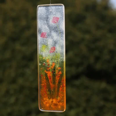 Back of flower suncatcher is flat showing the background.