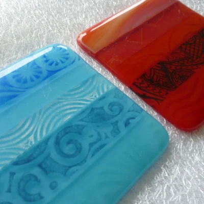 Close up of pattern on fused glass coasters.