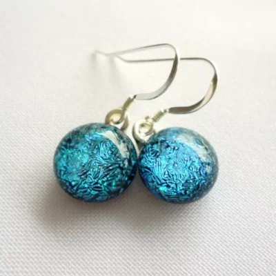 Handmade blue teal dichroic glass earrings.