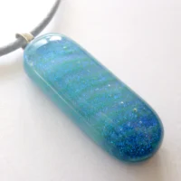 Handmade dichroic glass pendant with smooth glossy finish