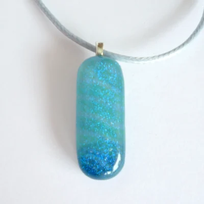 Front view of handmade blue glass pendant