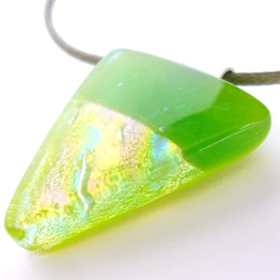 Triangular green dichroic glass pendant showing turquoise pink and gold shimmer