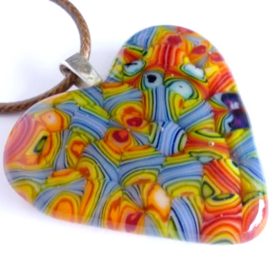 Heart shaped glass pendant showing red, green and blue.