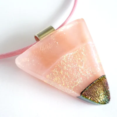 Handmade triangle shaped pink dichroic glass pendant with sterling silver bail