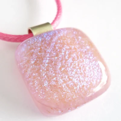 Close up of dichroic glass pendant