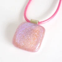 Handmade pink glass pendant with dichroic glass