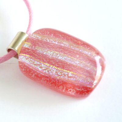 Handmade pink stripe dichroic glass pendant with 925 sterling silver bail and pink cord necklace.