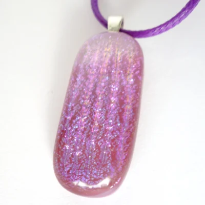 Purple pink glass pendant with dichroic stripes and purple cord necklace