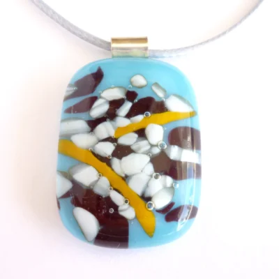 Front view of reactive glass pendant necklace with colours of blue white brown and orange