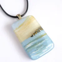Cream and blue hand painted fused glass seascape pendant with sterling silver bail and cord necklace