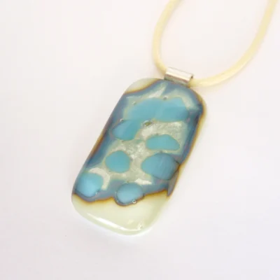 Different angle of pendant showing outline of chemical reaction.