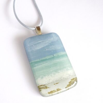 Hand-painted fused glass seascape pendant in mint and blue, sterling silver bail attached