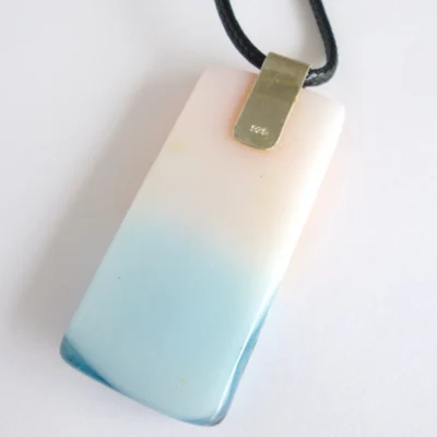 White back of fused glass pendant with sterling silver bail