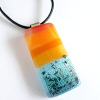Orange and blue seascape fused glass pendant with sterling silver bail and cord necklace