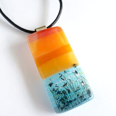 Orange and blue seascape fused glass pendant with sterling silver bail and cord necklace