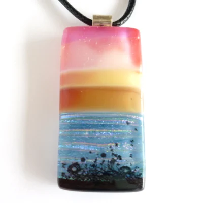 Close up of seascape fused glass pendant