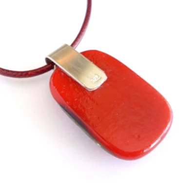 Back of red pendant with large silver plate bail