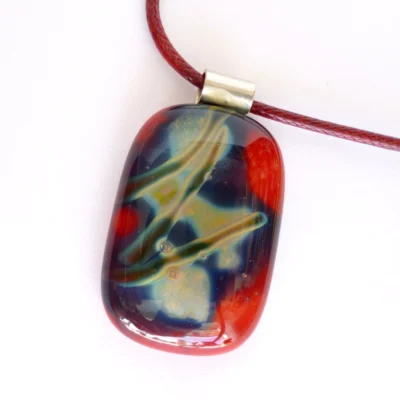 Red reactive glass pendant necklace with sterling silver bail