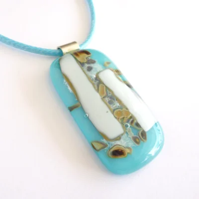 Turquoise and white reactive glass pendant necklace with sterling silver bail and blue cord