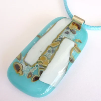 Oblong turquoise blue, white and silver reactive glass pendant with blue cord necklace