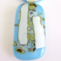 Close up of turquoise and white reactive glass pendant necklace
