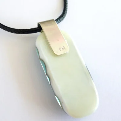 Back of vanilla pendant with sterling silver bail attached