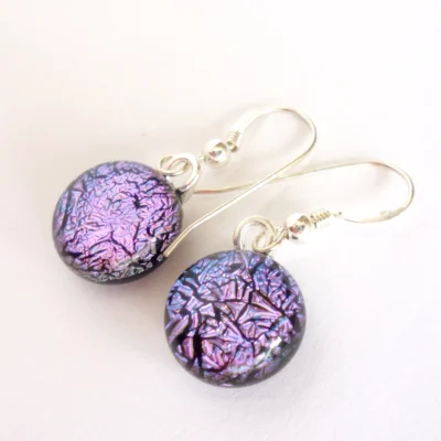 Pink dichroic glass earrings. Handmade round pink cabochons attached to silver plated bails and hang from 925 sterling silver ear wires.