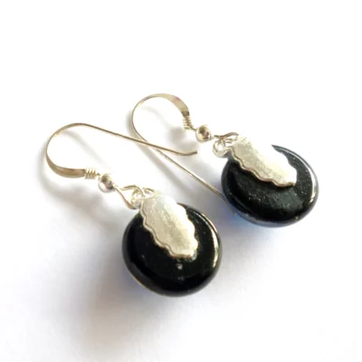 Back of dichroic glass earrings with silver plated bails attached.
