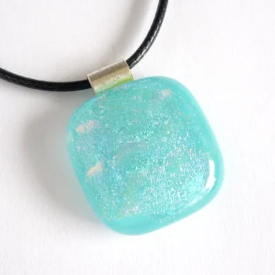 Handmade square turquoise blue dichroic glass pendant with 925 sterling silver bail and black cord necklace.