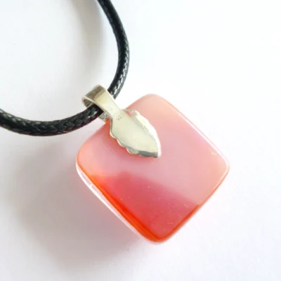 Back of fused glass pendant is a streaky pink with 925 sterling silver bail attached.