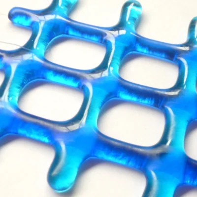 Close up of two-tone lattice fused glass suncatcher, showing depth of glass.